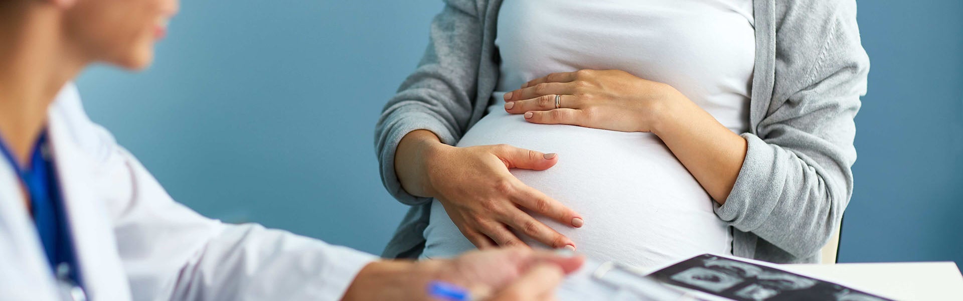 Pregnant woman with doctor