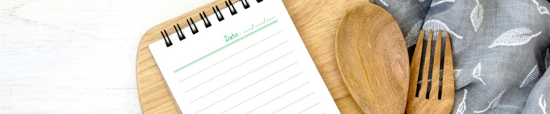 Diary page with wooden spoon and fork