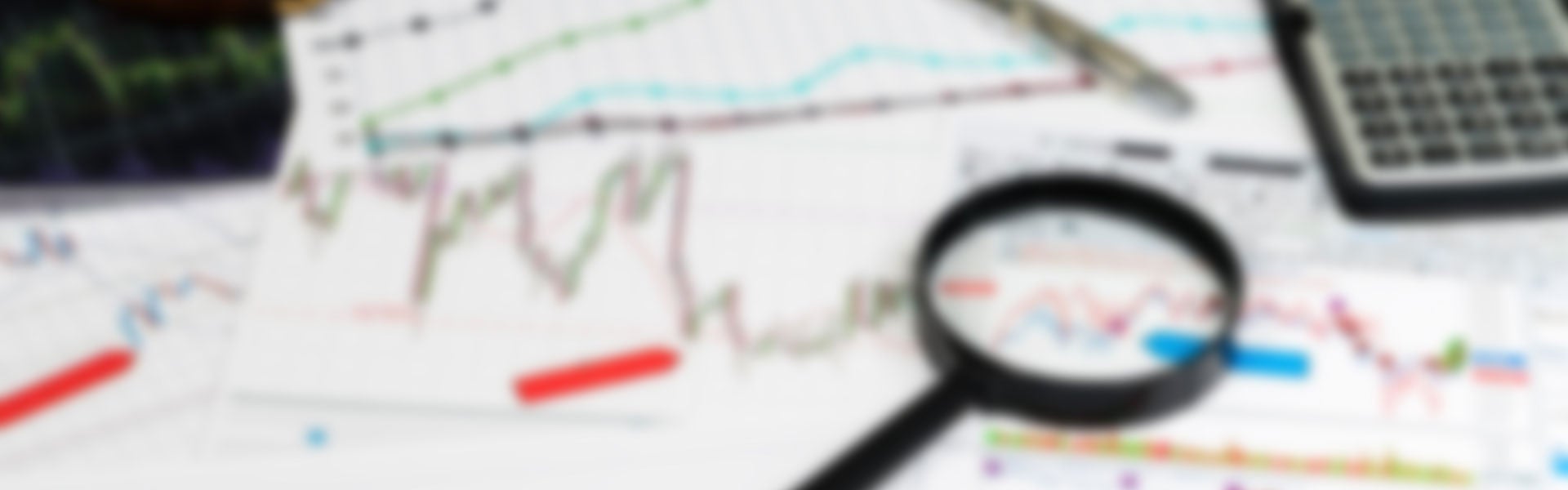 Magnifying glass over charts
