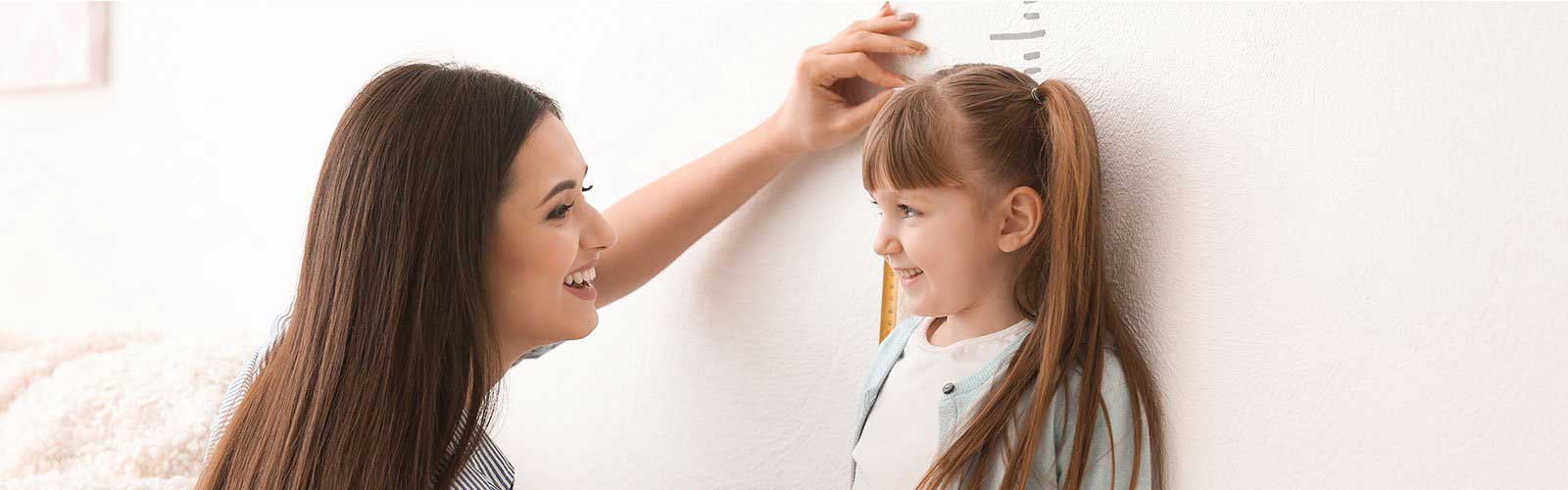 Child getting height measured