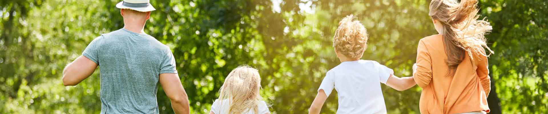 Family running into woods