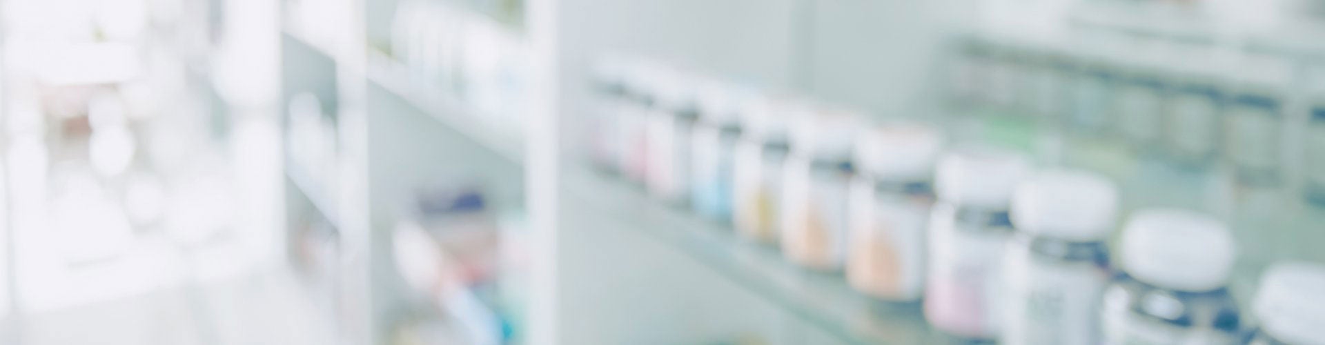 Medicine bottles on rows of shelves
