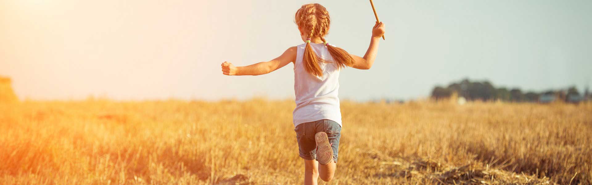 Girl running in a field