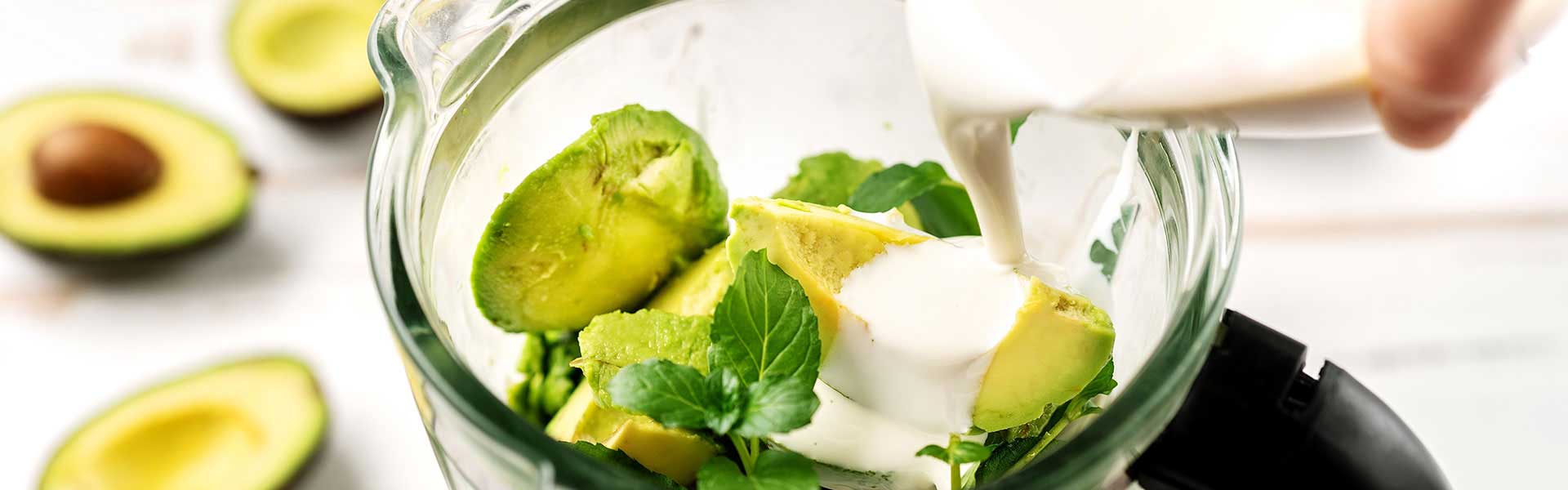 Avocado in a bowl with cream poured on top