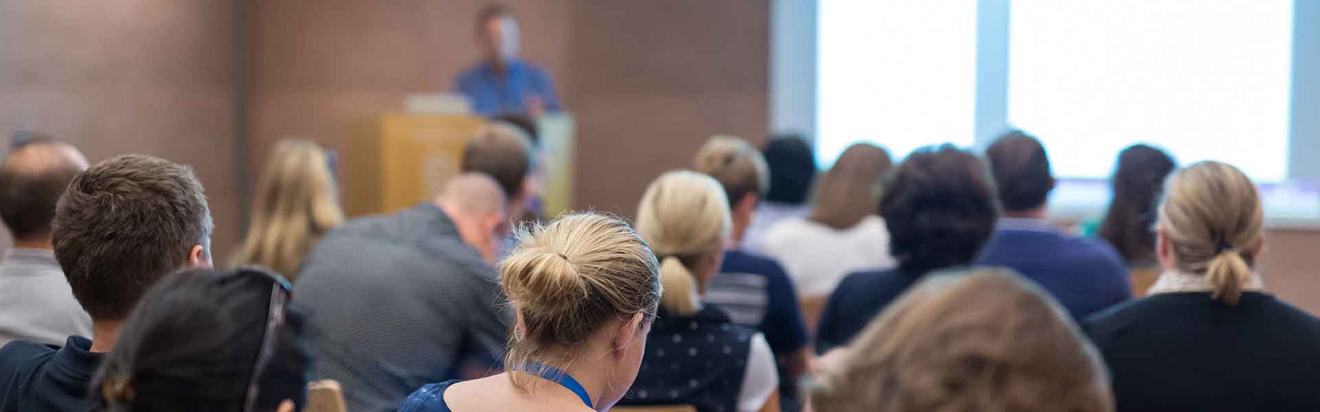 Speaker talking to a room of people
