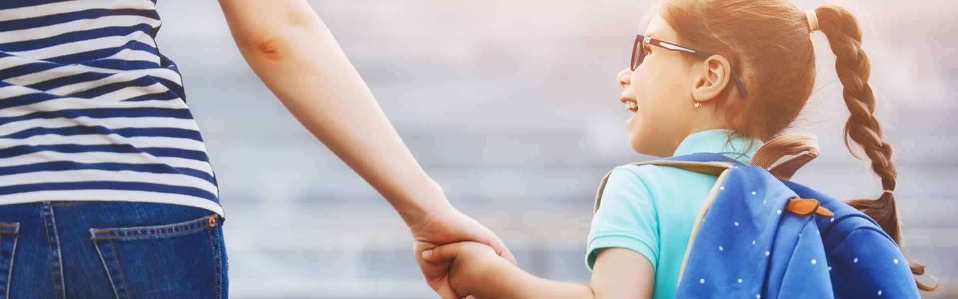 Girl holding mother's hand