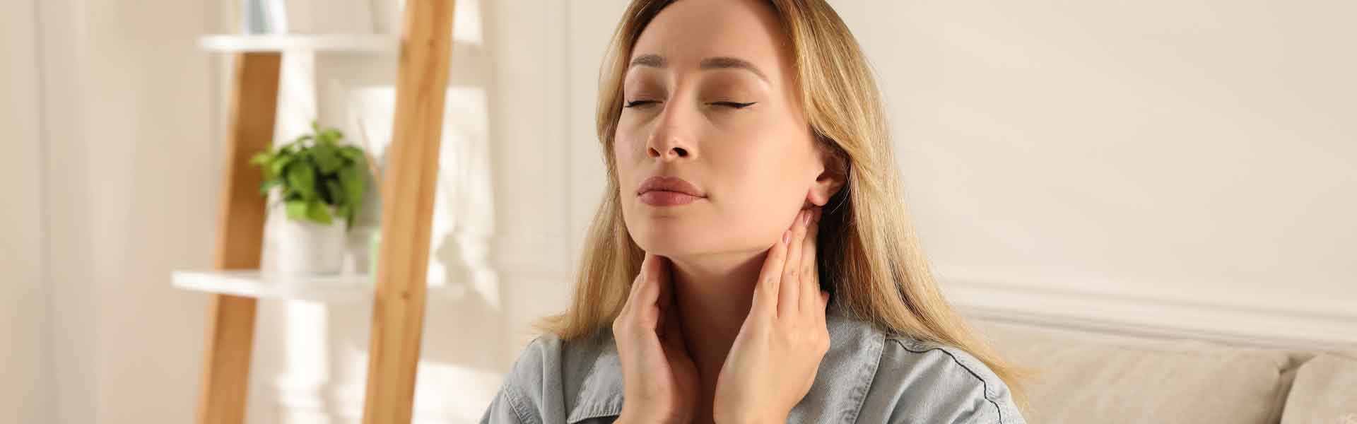 Woman touching her neck