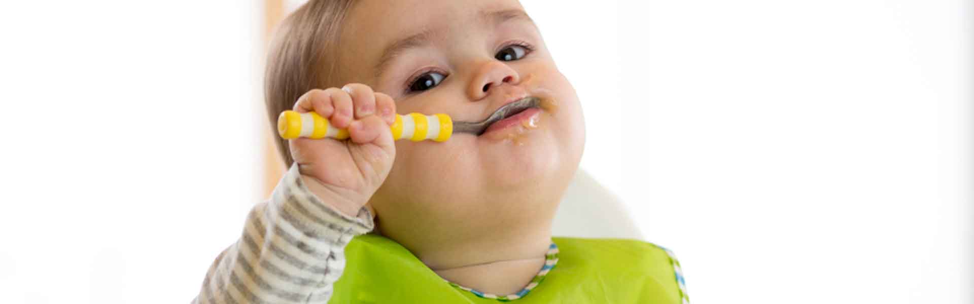 Child holding a spoon