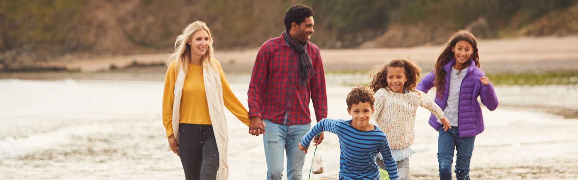 Family walking on beach