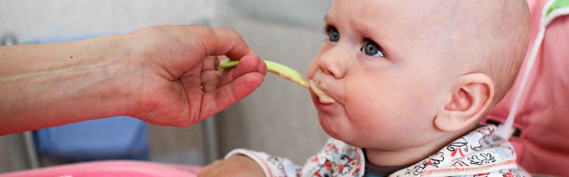 Toddler being fed
