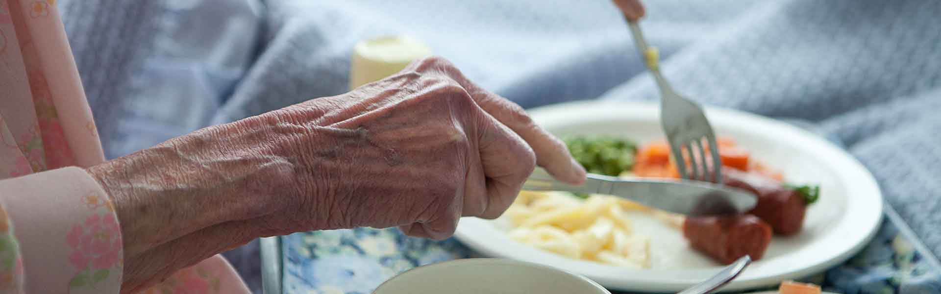 Elderly person eating