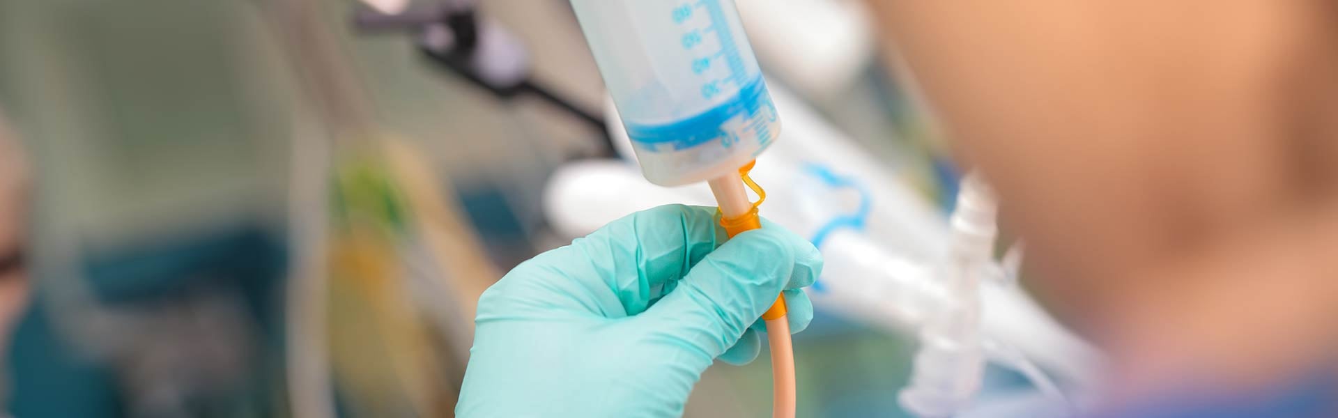 Doctor preparing feeding tube