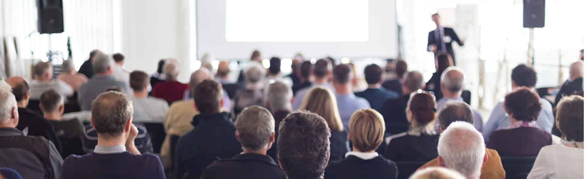audience watching a speaker