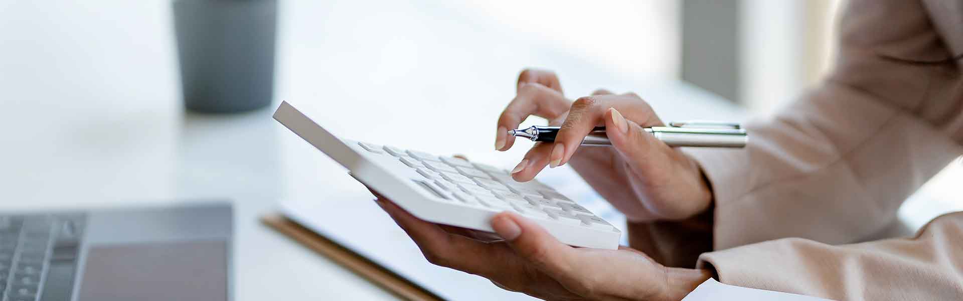 Woman holding a calculator