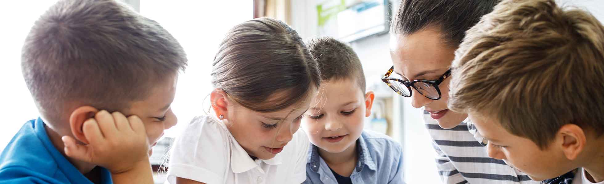 Teacher reading with kids