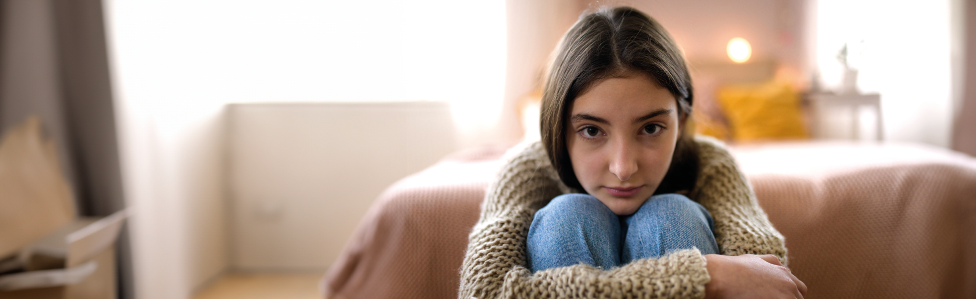 girl sat with arms folded