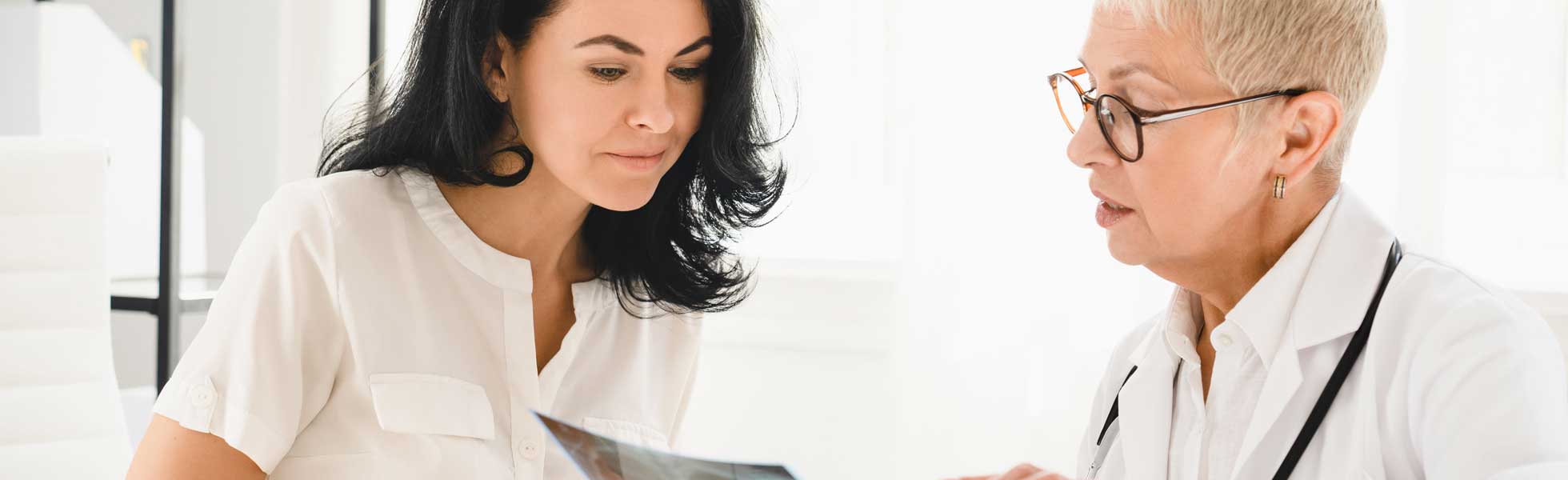 healthcare professional pointing to a xray