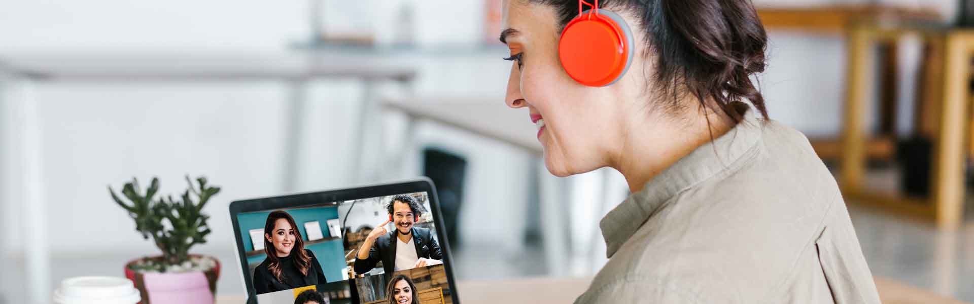 Woman looking at a screen with a video conference call
