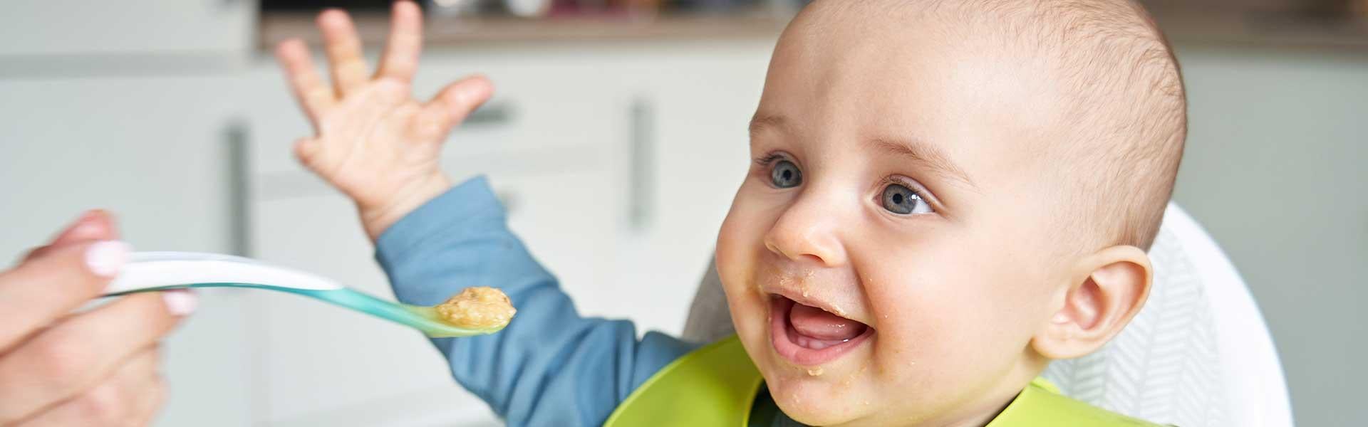 Infant being spoon fed