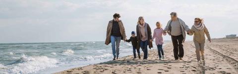 Family walking on beach