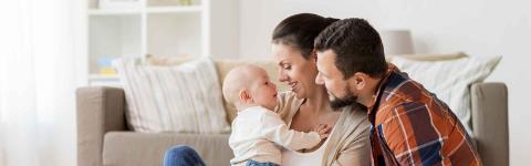 Family playing with their baby