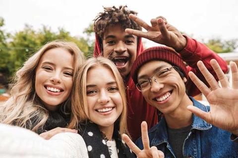 Group of young people taking a selfie
